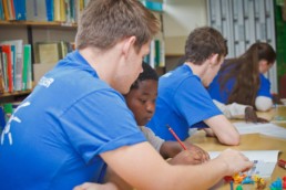 Vinnies Youth Members tutoring young children in a library