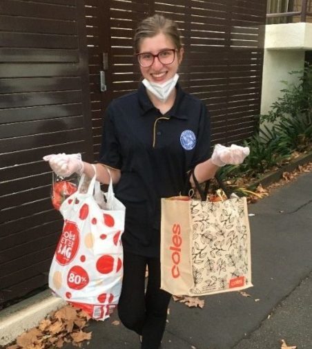 Vinnies Youth Member distributing hampers